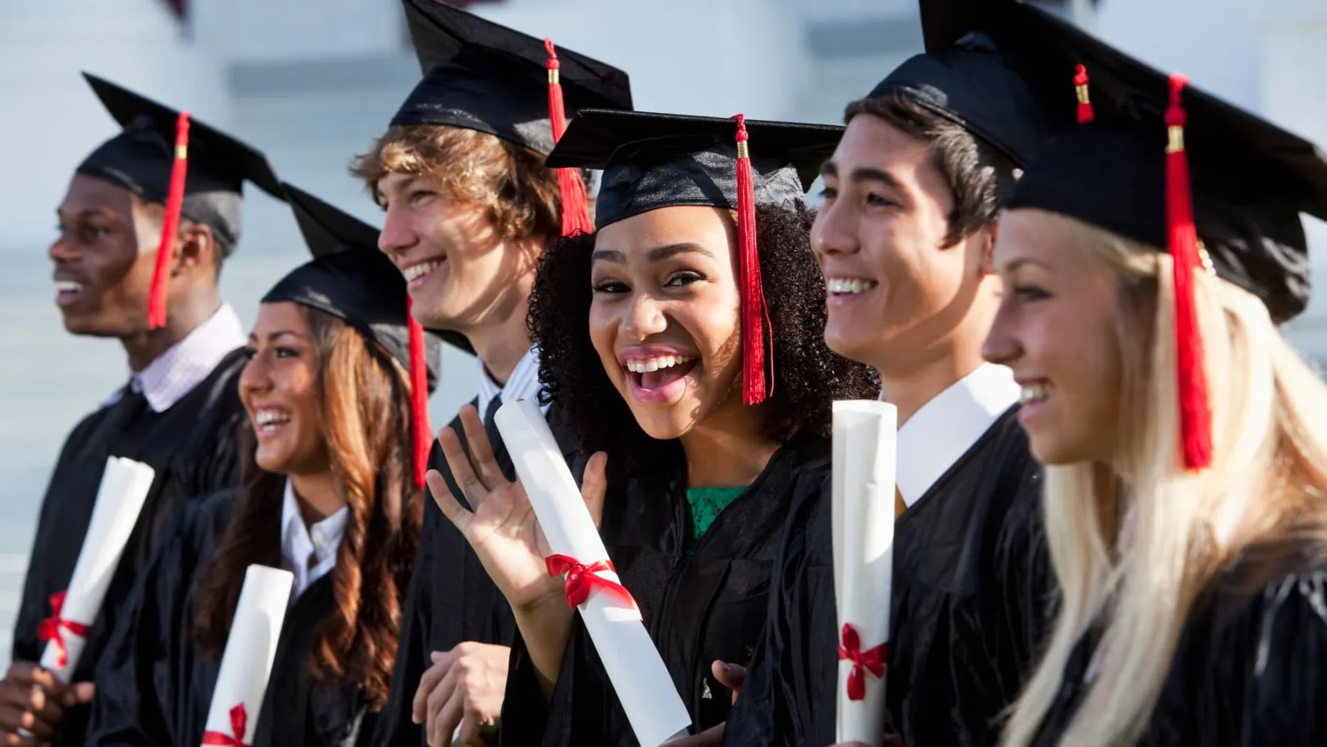 Diverse students celebrating graduation